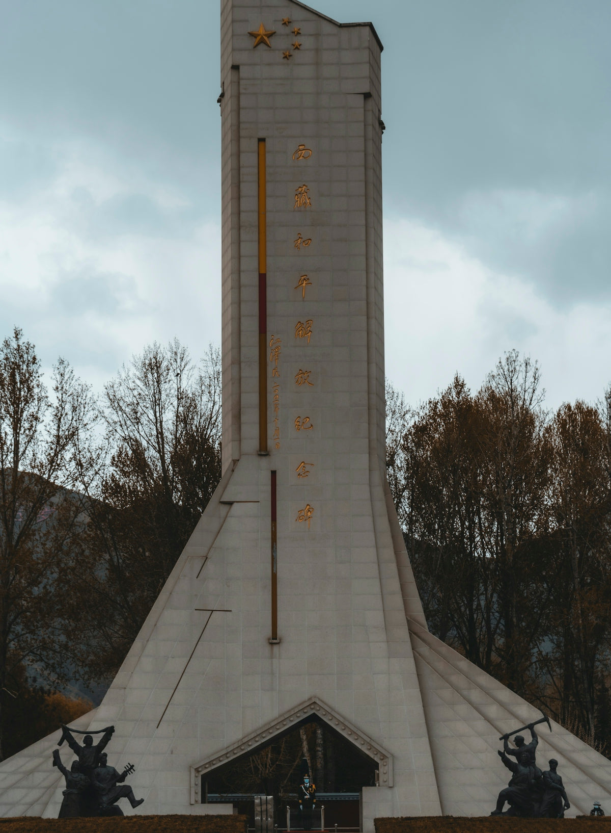 a tall white building with a clock on it's side