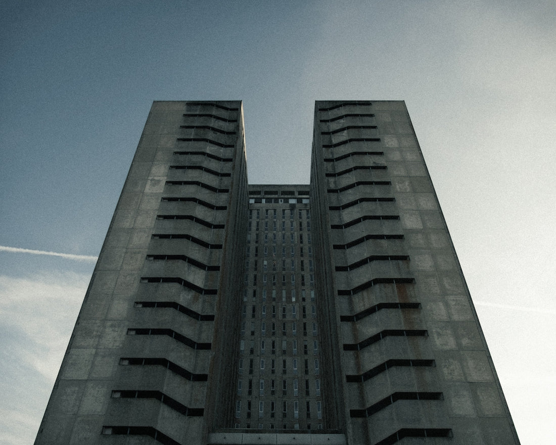 A towering, symmetrical concrete building reaching skyward.