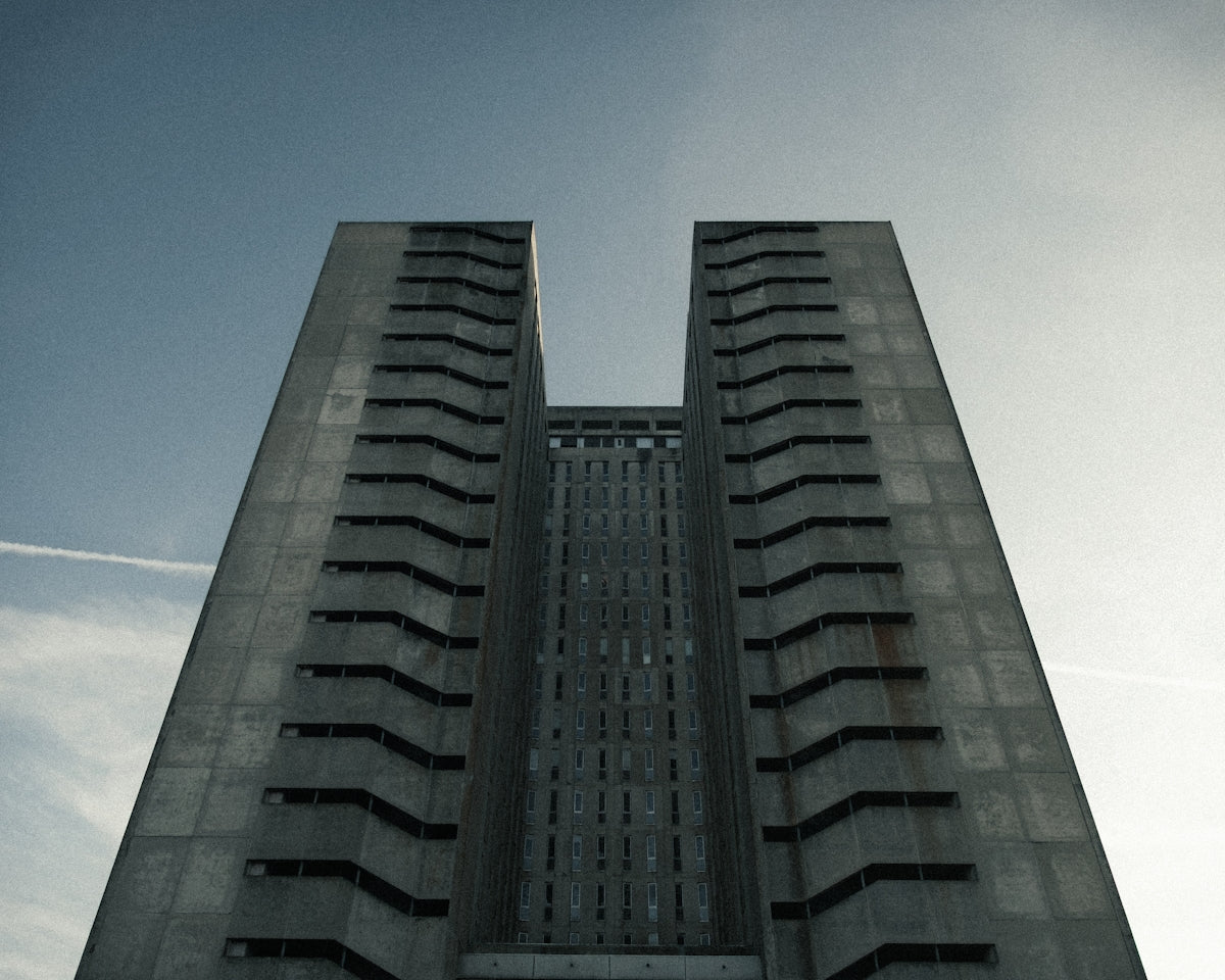 A towering, symmetrical concrete building reaching skyward.