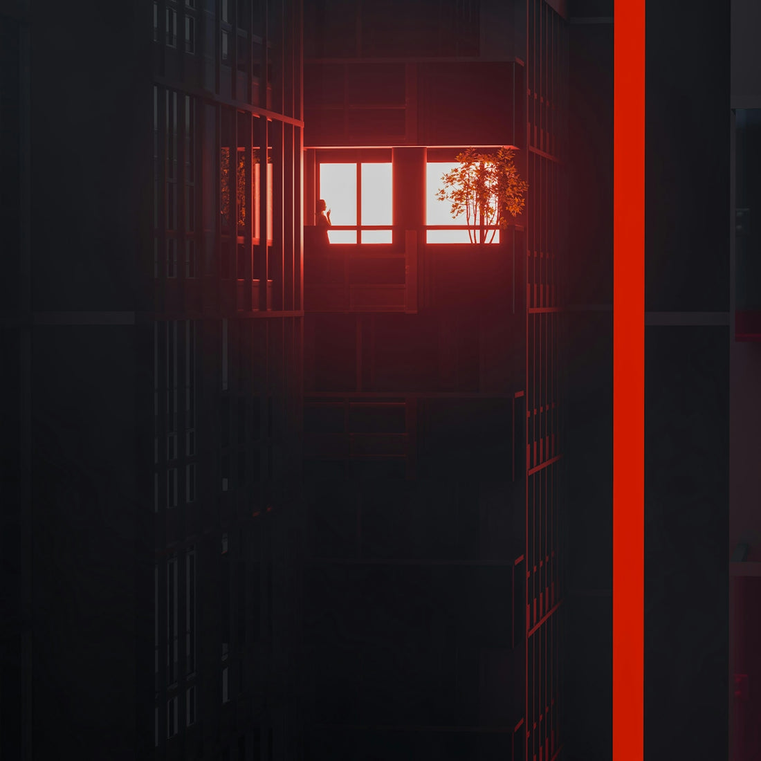 Dark building facade with illuminated windows at sunset.